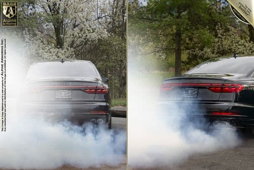 A black Audi car is shown driving on a road. The left image shows minimal smoke from the tires, while the right image shows significant smoke around the tires. Trees are visible in the background.