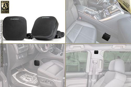 A car interior equipped with two small black speakers. The speakers are shown installed in various locations within the car, including the dashboard, below the seats, and on passenger doors.